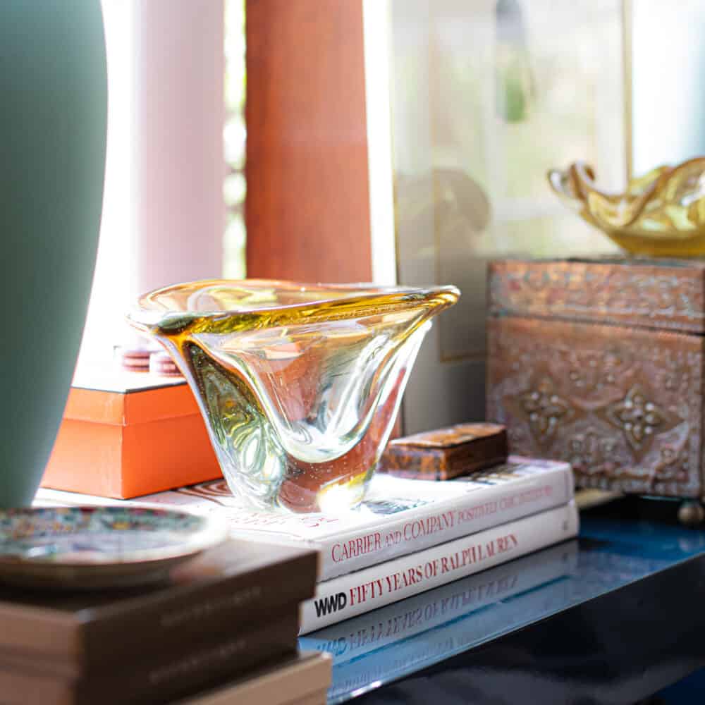 Murano glass bowl on top of design books